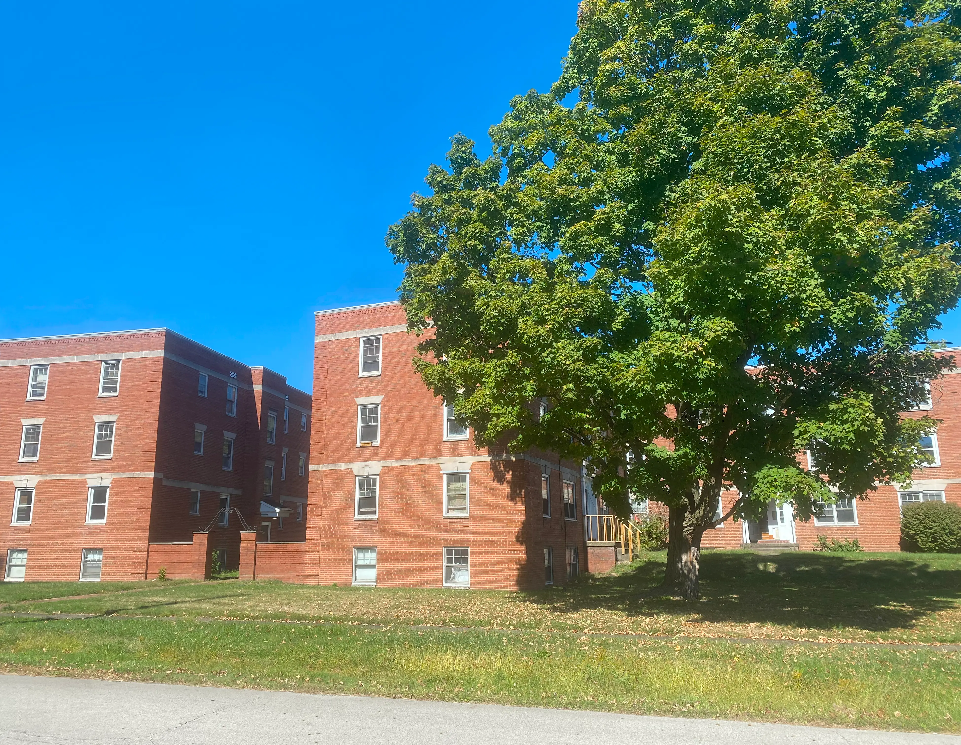 Southview Apartments brick buildings surrounded by mature trees